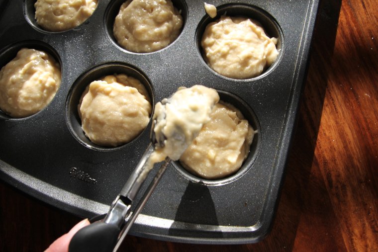 scooping batter into prepared pan