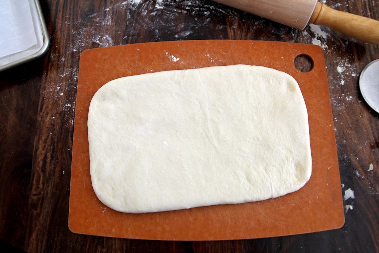 roll dough to a 12x7-inch rectangle on a lightly floured cutting board