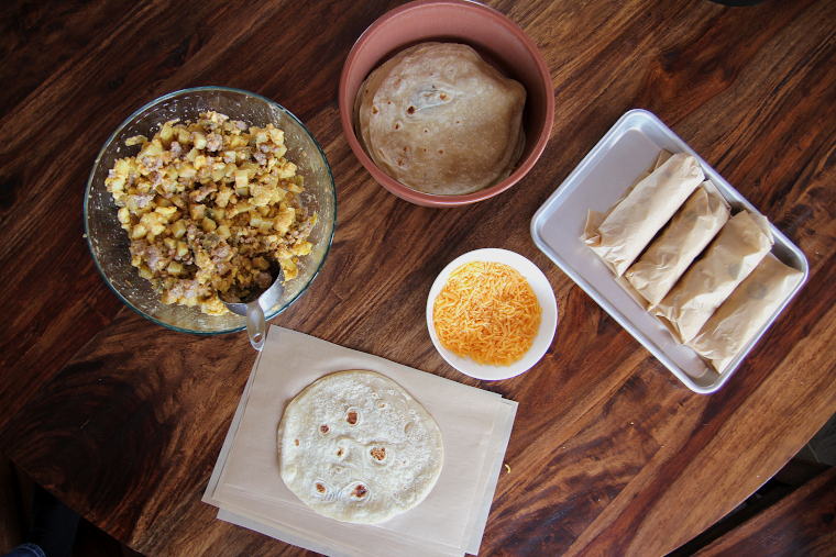 breakfast burrito filling station at kitchen table