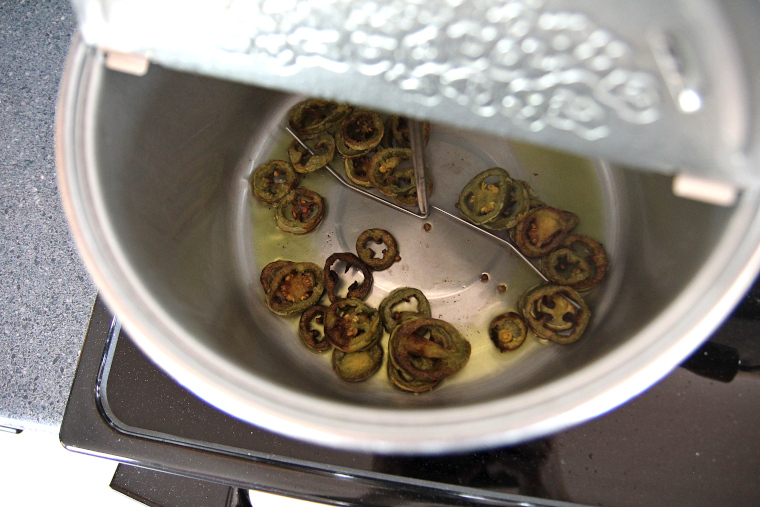 golden brown jalapeno slices in popper