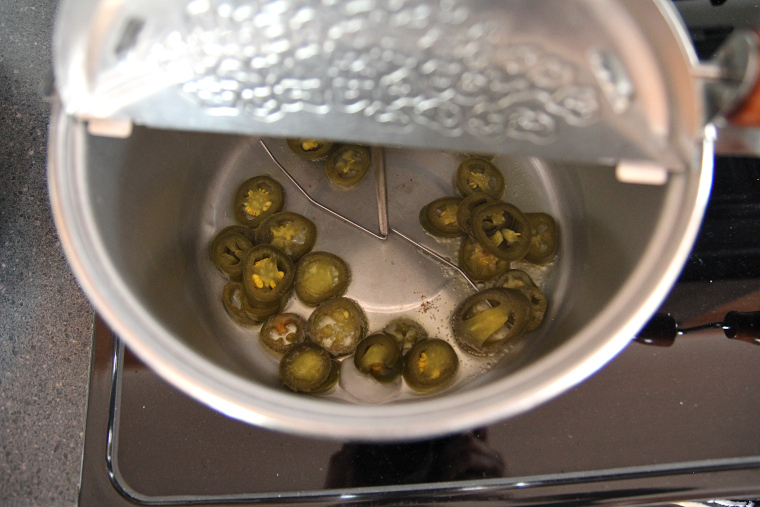 oil and jalapenos in popcorn popper