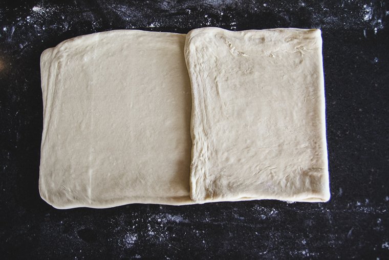 folding the dough in thirds as if folding a letter