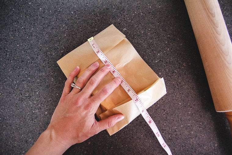 making a parchment paper package around the butter in the dimensions I want the finished butter block