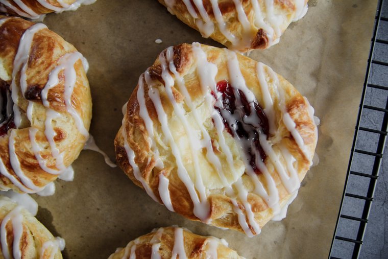 a homemade sourdough danish pastry close up on a cooling rack with parchment paper