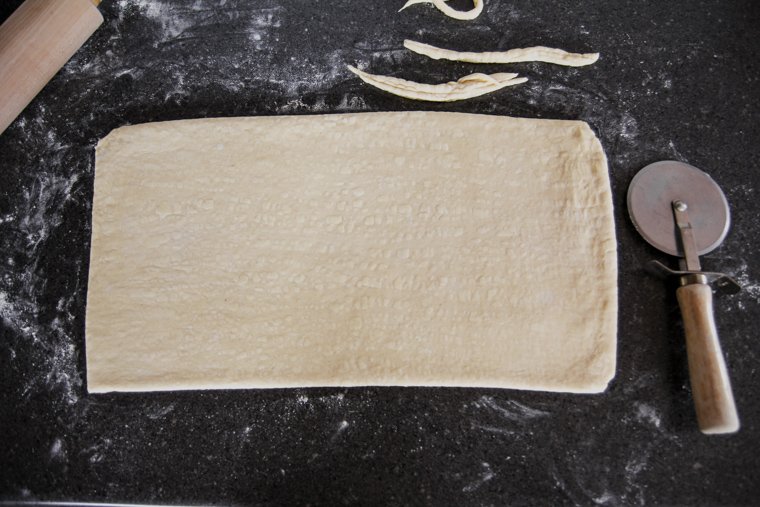 rolled pastry dough with trimmed edges
