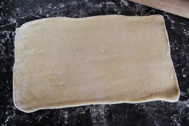 Sourdough danish dough rolled into a rectangle in preparation for the first fold