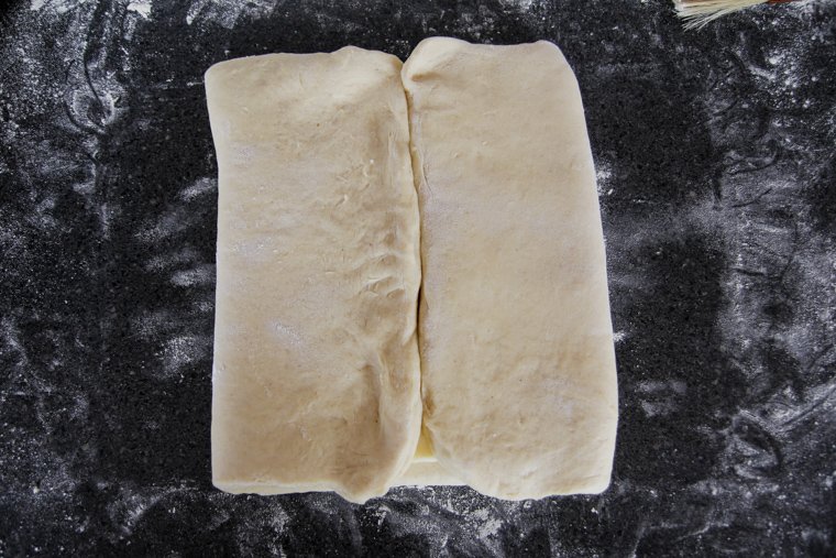 Dough ends meeting in the center of the butter block.