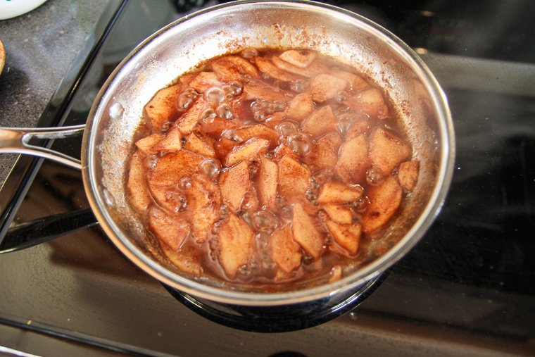 the apple topping after the apples are tender and the syrup has reduced