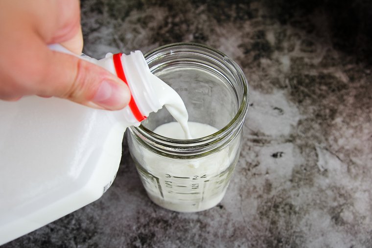 pouring milk into the jar