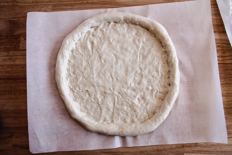 a sourdough pizza crust after shaping