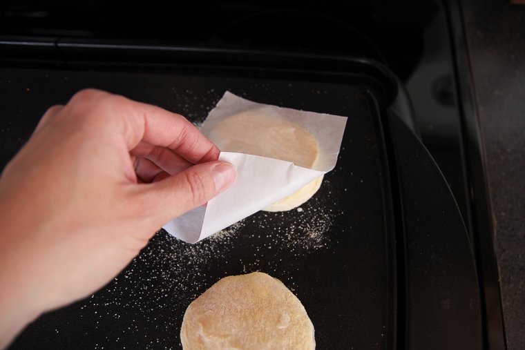 inverting an english muffin onto a griddle