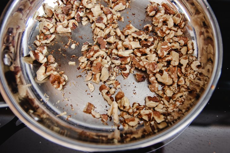toasting the chopped walnuts in a skillet