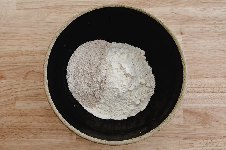 whole wheat, rye, and all-purpose flours in a bowl
