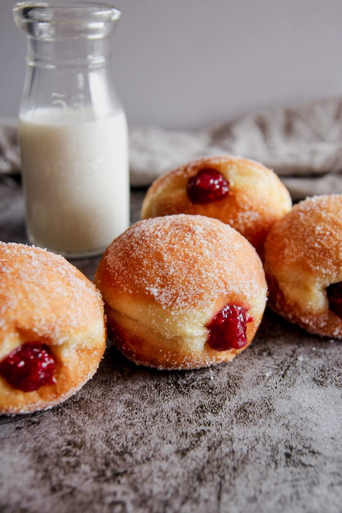 donuts next to a jar of milk