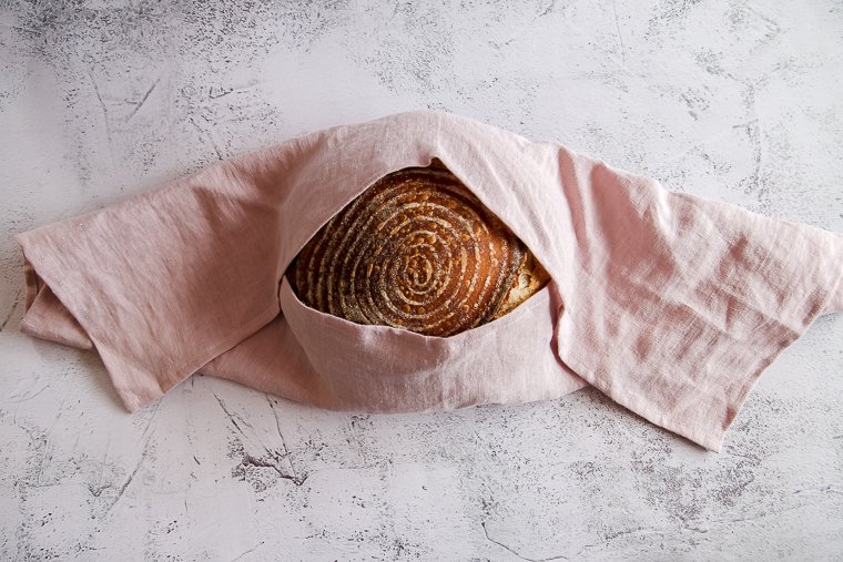 how to wrap round bread as a gift in a tea towel tied with twine