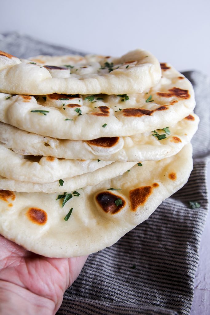 a stack of 6 sourdough naan flatbreads