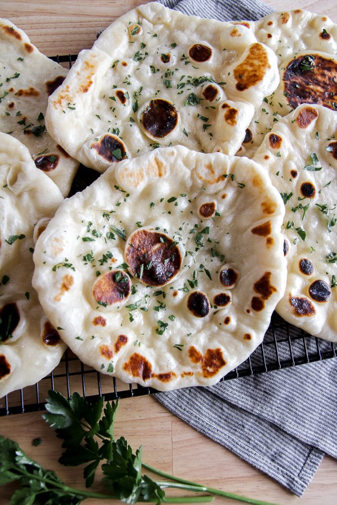 sourdough naan on a cooling rack