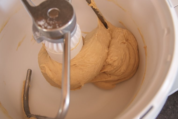 sourdough burger bun dough pulling away from the sides of the mixer after kneading