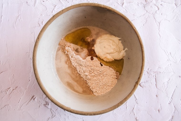 a bowl with sourdough pita bread ingredients