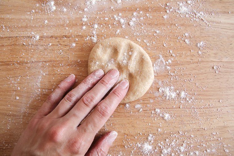 pressing the tortilla dough