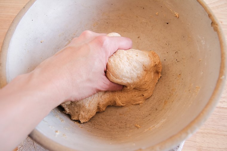 squeezing and kneading the sourdough tortilla dough