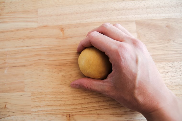shaping the pumpkin sourdough dough into balls