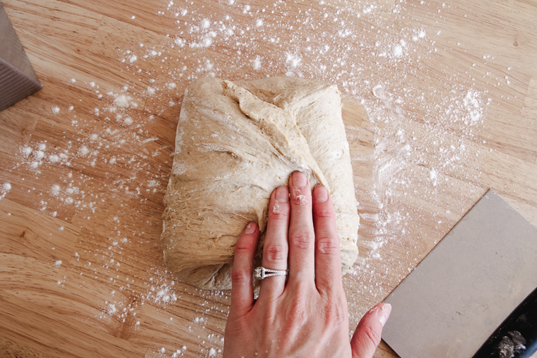 folding in the left side of the dough