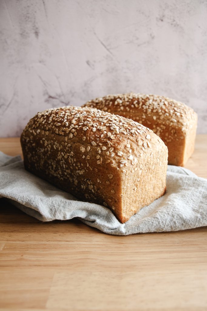 two loaves of oat porridge sourdough bread