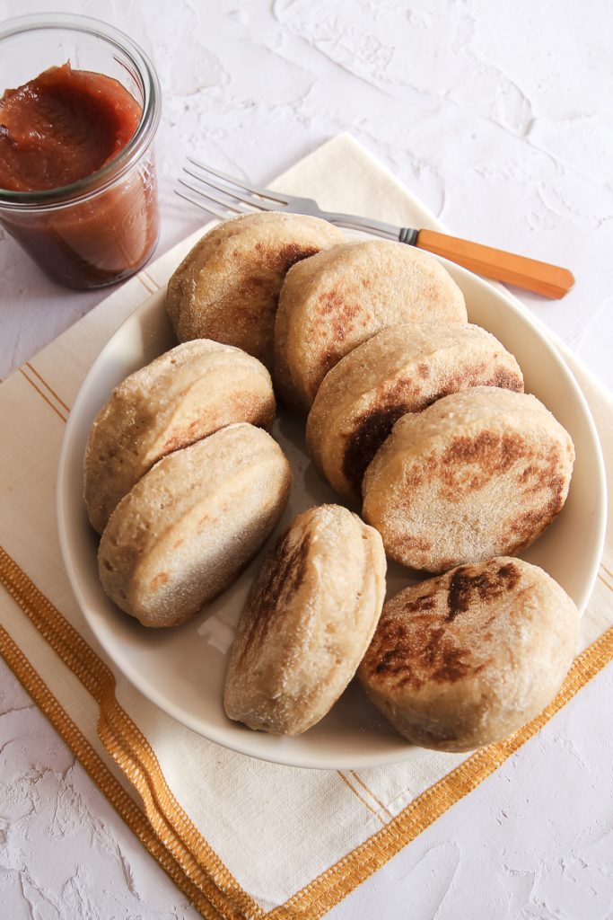 a bowl of whole wheat english muffins made from scratch