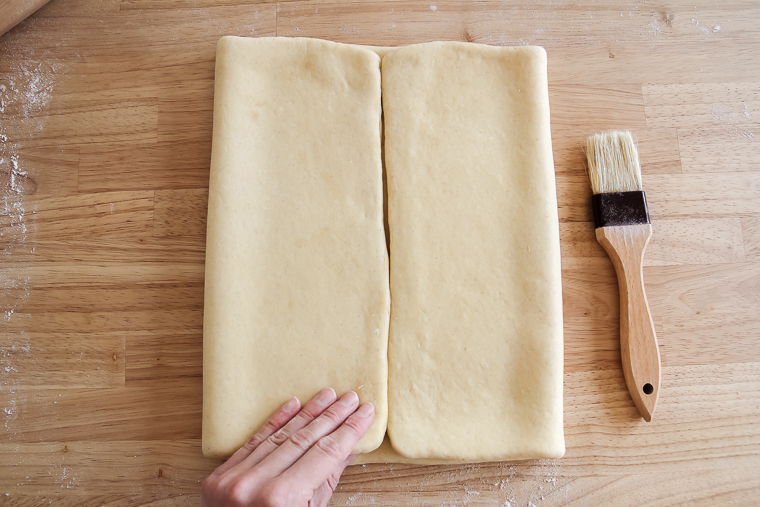 folding both sides of the sourdough pastry dough to meet in the middle
