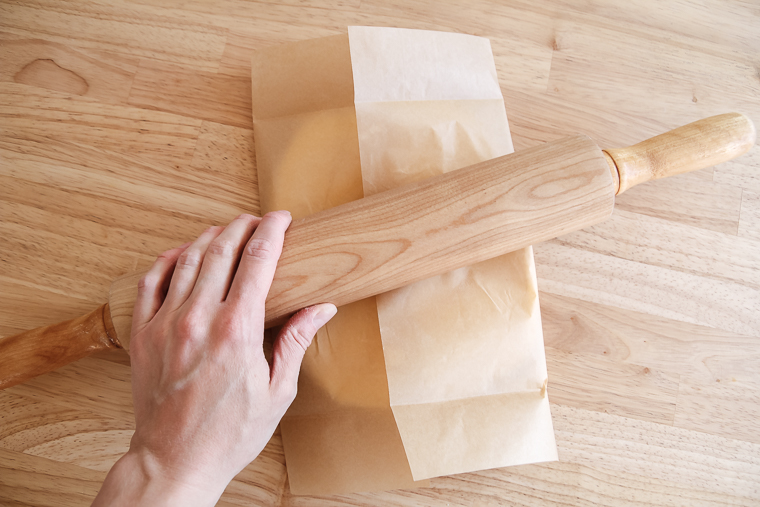 rolling the butter to fill the parchment paper