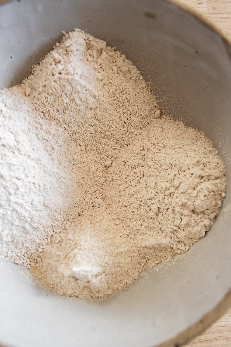 freshly milled einkorn flour in a stoneware bowl