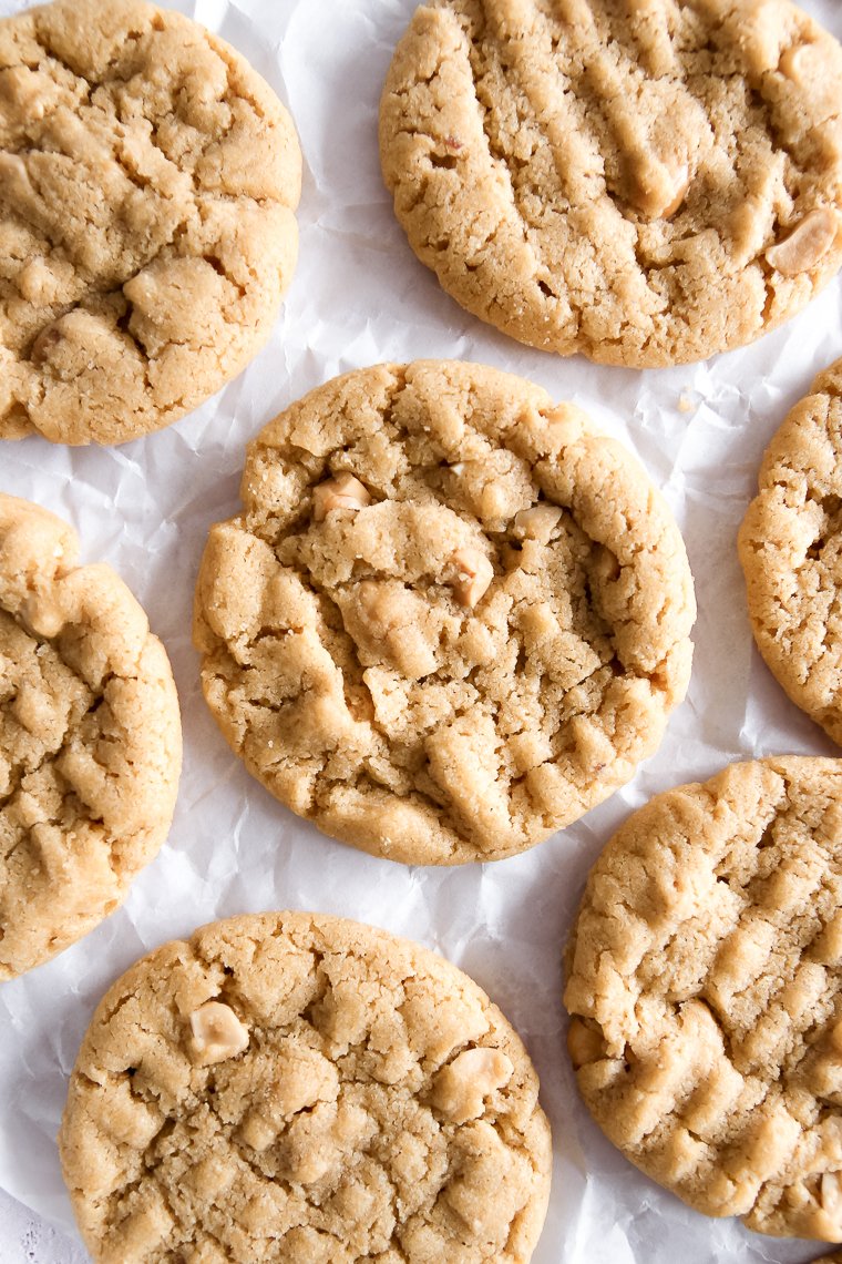 whole wheat peanut butter cookies on a piece of white parchment paper