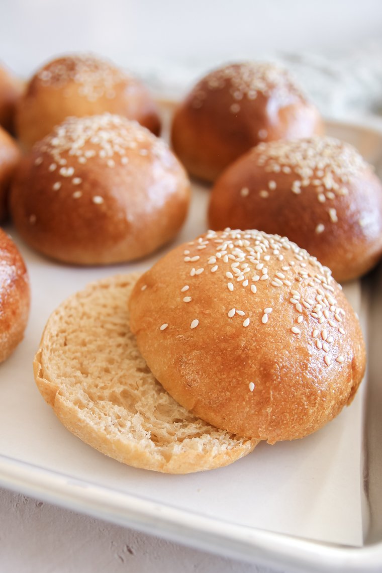 a sliced whole wheat bun