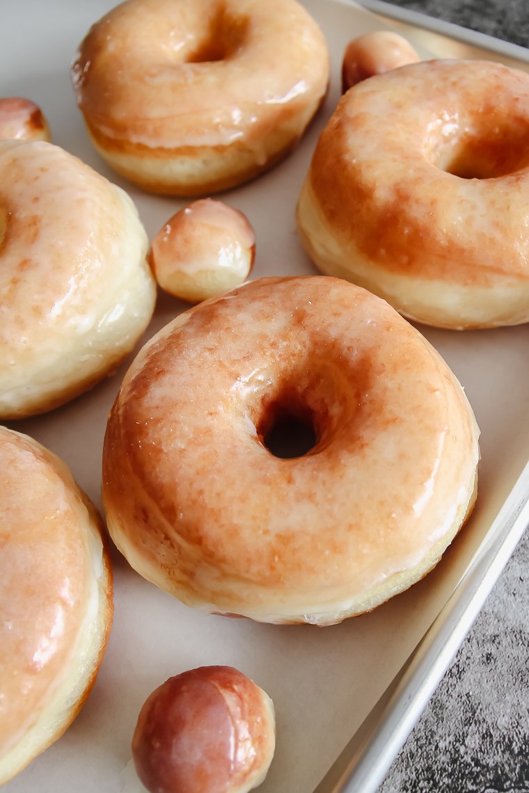 soft and fluffy sourdough raised donuts with vanilla glaze