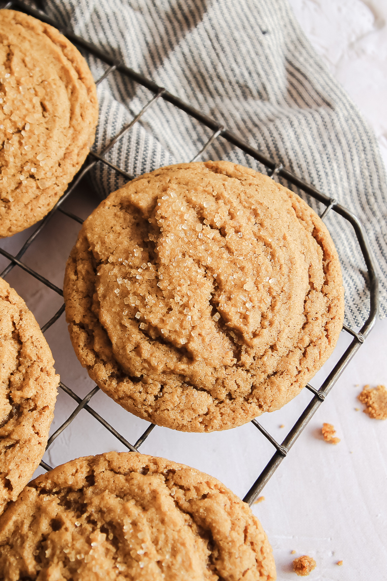 a close up of a soft molasses cookie with a coarse sugar topping