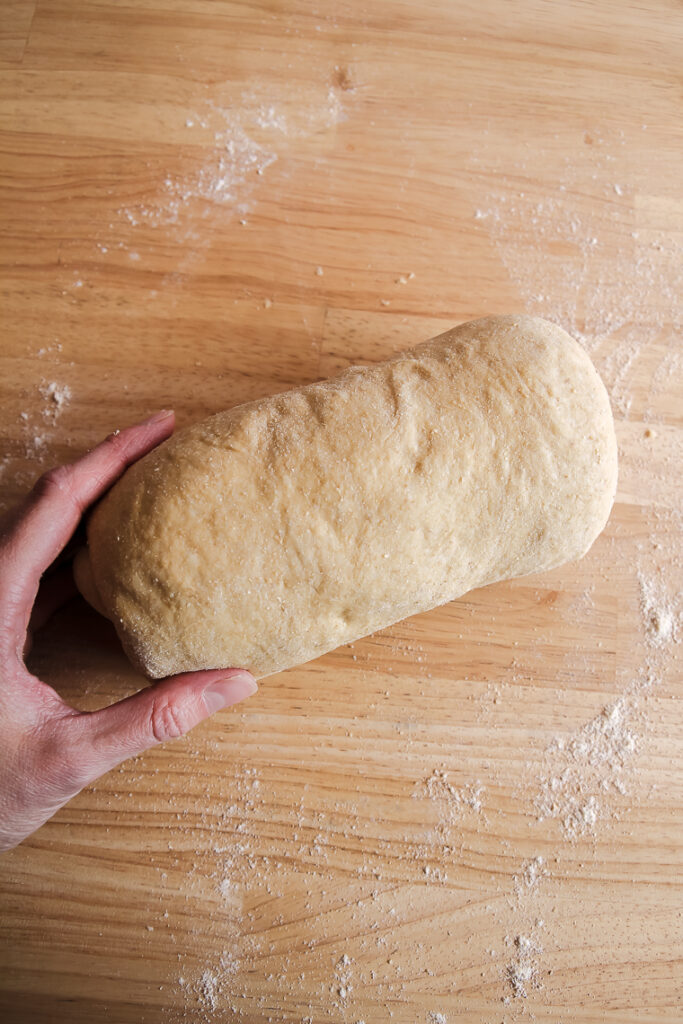 shaped loaf of whole wheat sourdough sandwich bread