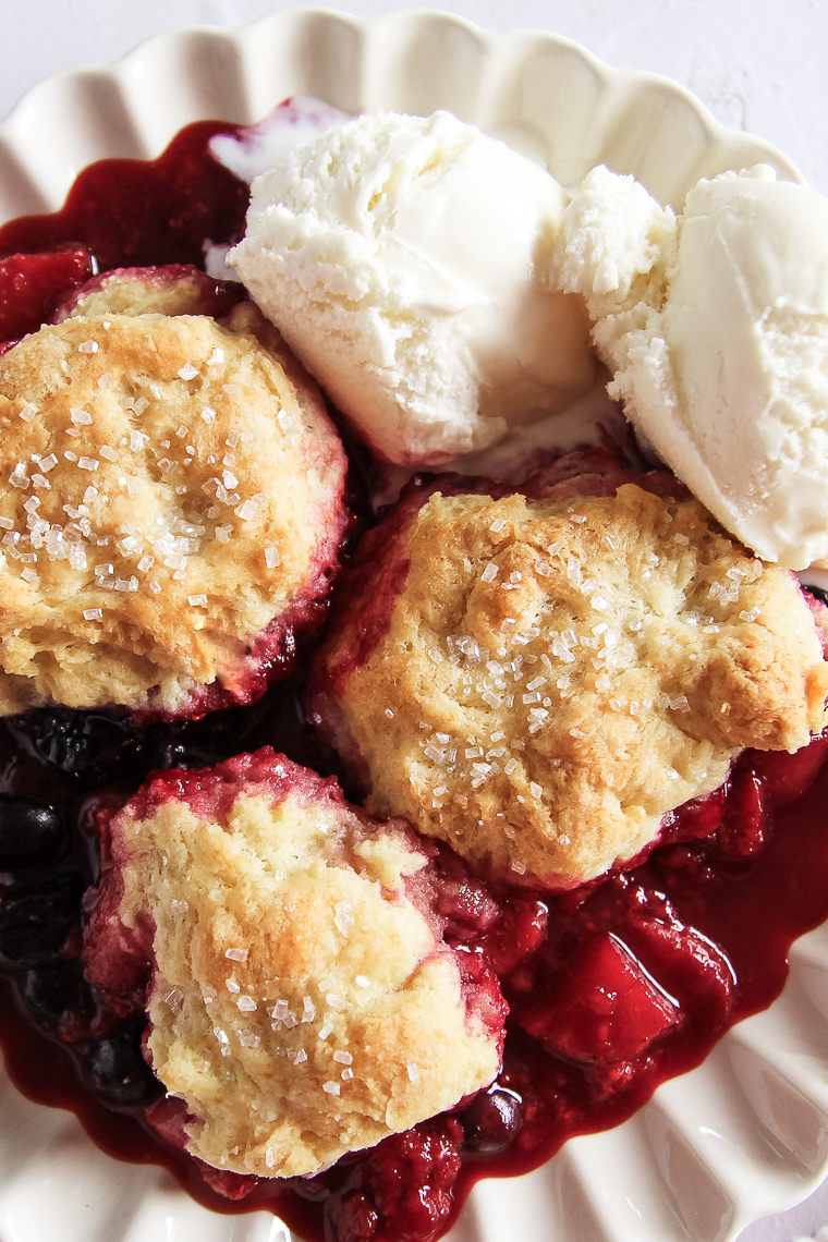 a close up of the berry cobbler with biscuit topping