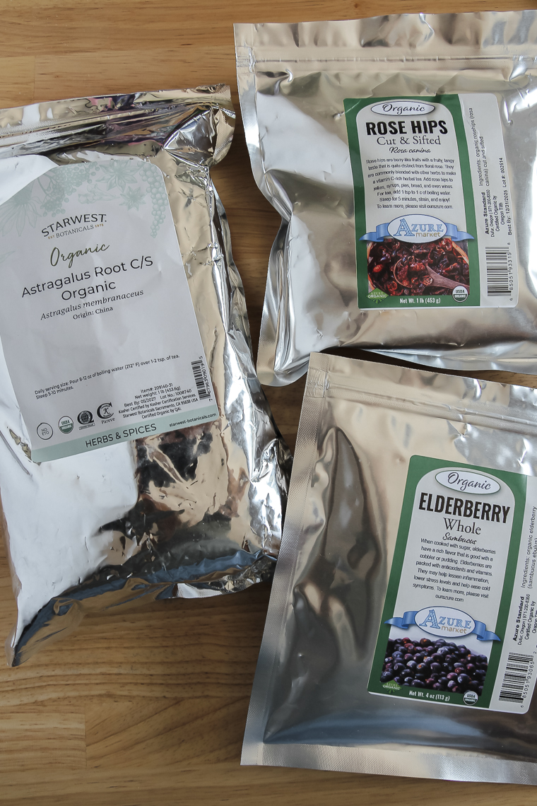 bags of bulk astragalus root, rose hips, and organic dried elderberries