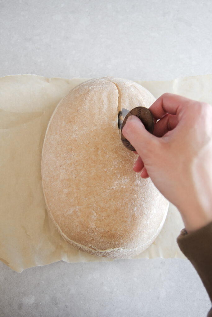 score loaf at a 45° angle with dough lame
